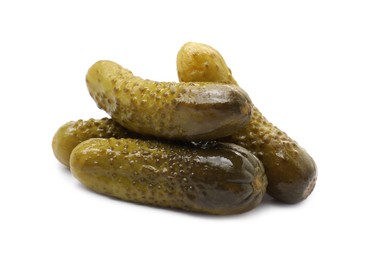 Photo of Pile of tasty pickled cucumbers isolated on white