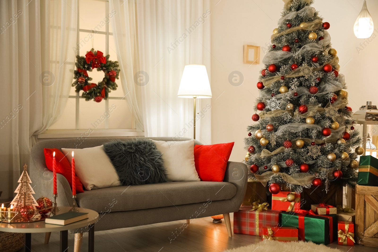 Image of Beautiful Christmas tree in living room. Festive interior