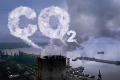Image of Inscription CO2 made of smoke. Aerial view of industrial factory