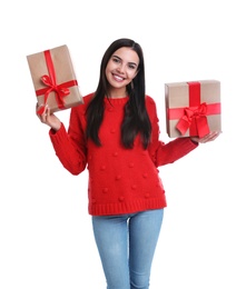 Photo of Happy young woman holding Christmas gifts on white background