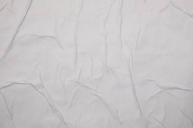 Top view of white creased blank poster as background, closeup