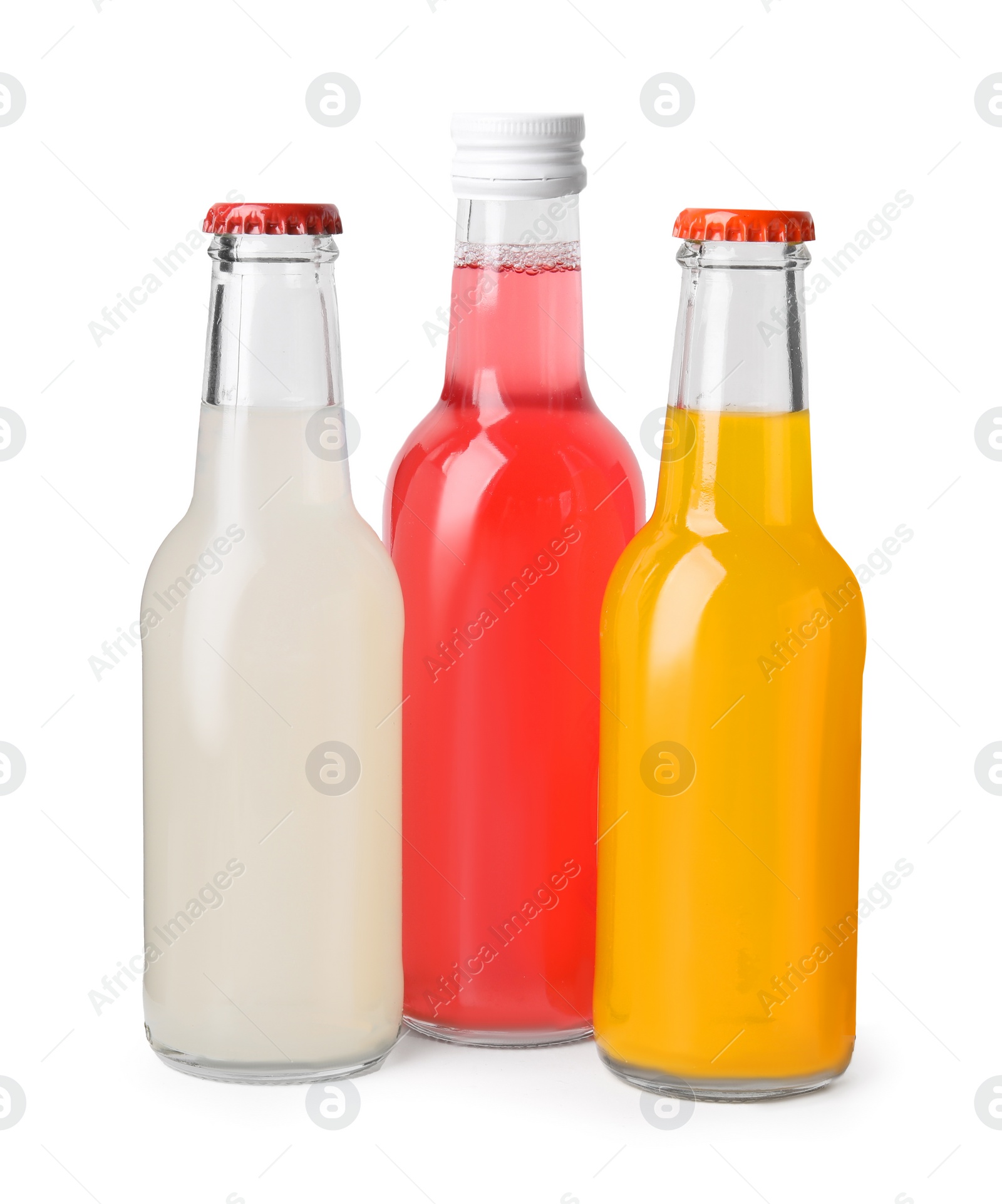 Photo of Delicious kombucha in glass bottles isolated on white