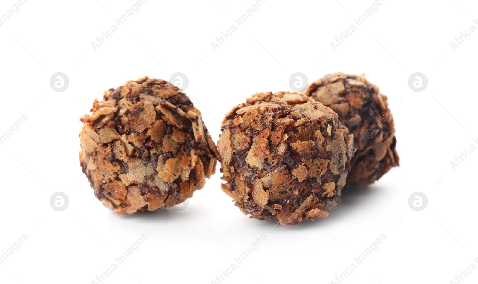 Photo of Delicious chocolate candies with waffle crumbles isolated on white