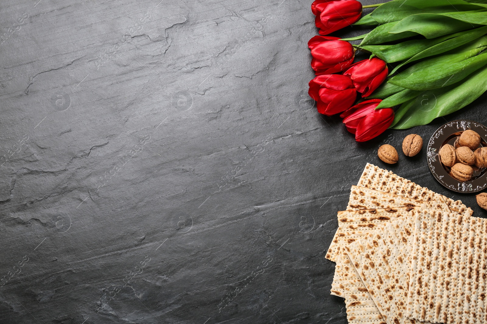 Photo of Flat lay composition with traditional Pesach (Passover Seder) matzo on grey table. Space for text