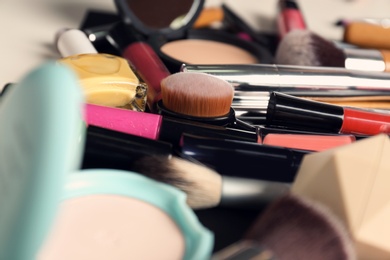 Photo of Set of different makeup products and tools as background, closeup
