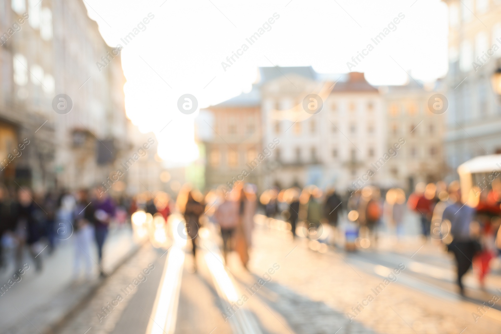 Photo of Blurred view of people walking on city street