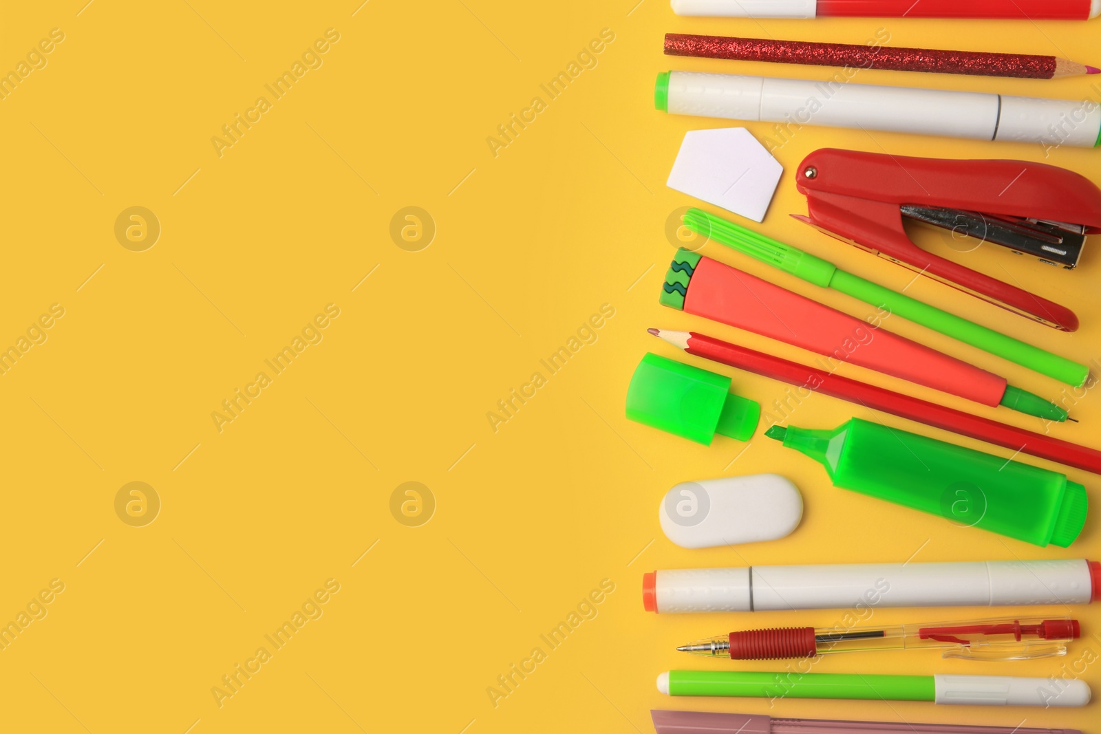 Photo of Flat lay composition with different school stationery on orange background, space for text. Back to school