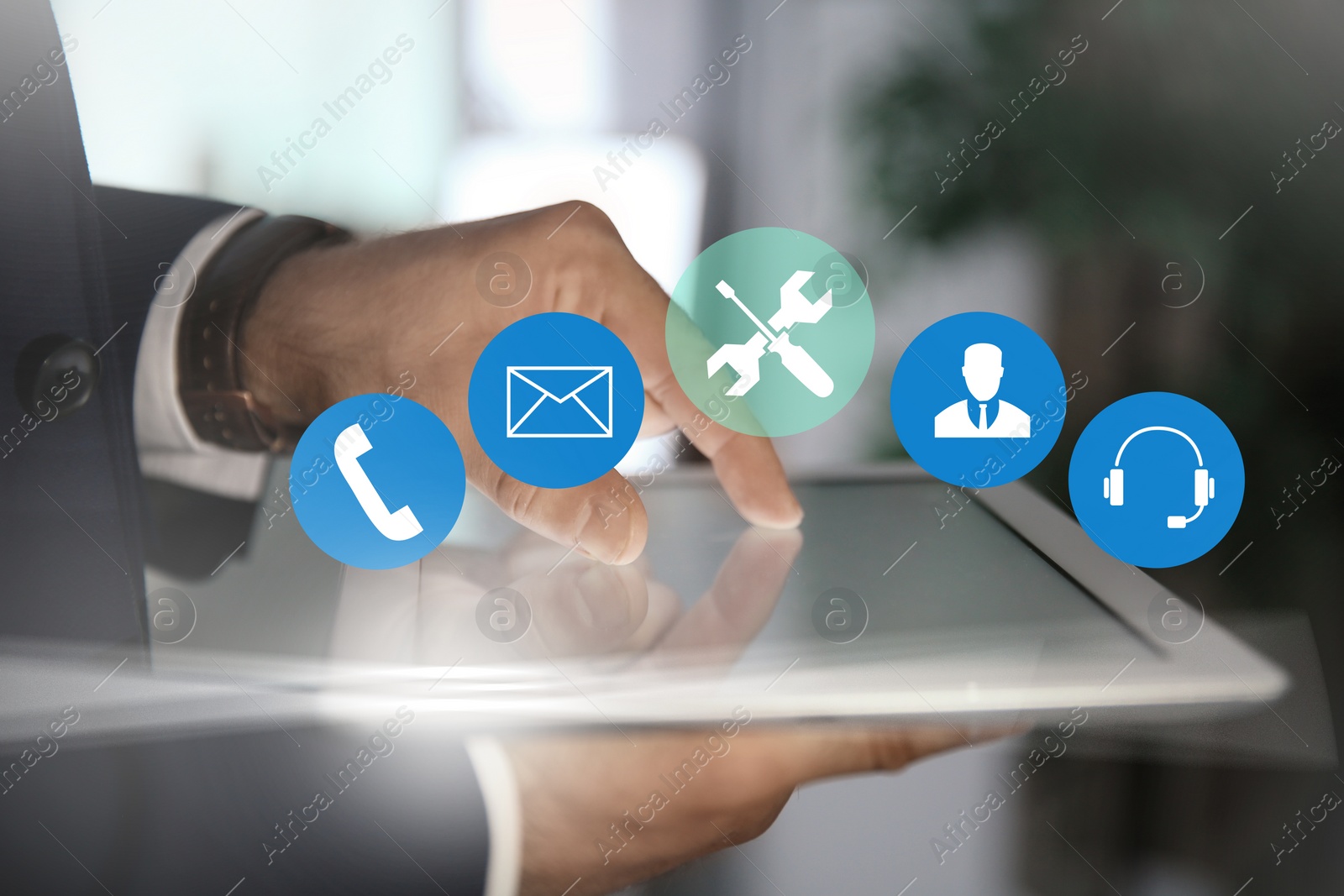 Image of Man using tablet at workplace, closeup. Technical support