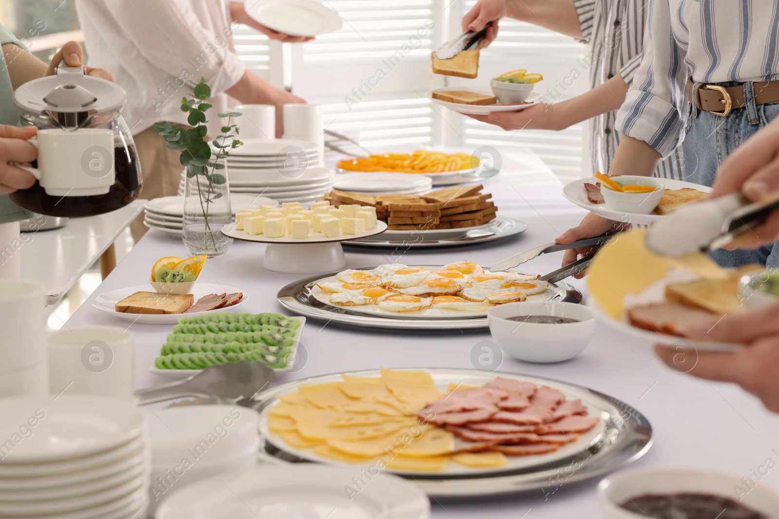 Photo of People taking food during breakfast, closeup. Buffet service