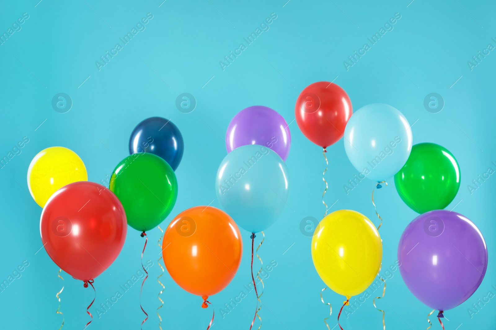 Photo of Bright balloons on color background. Celebration time