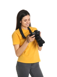 Photo of Young female photographer with camera on white background