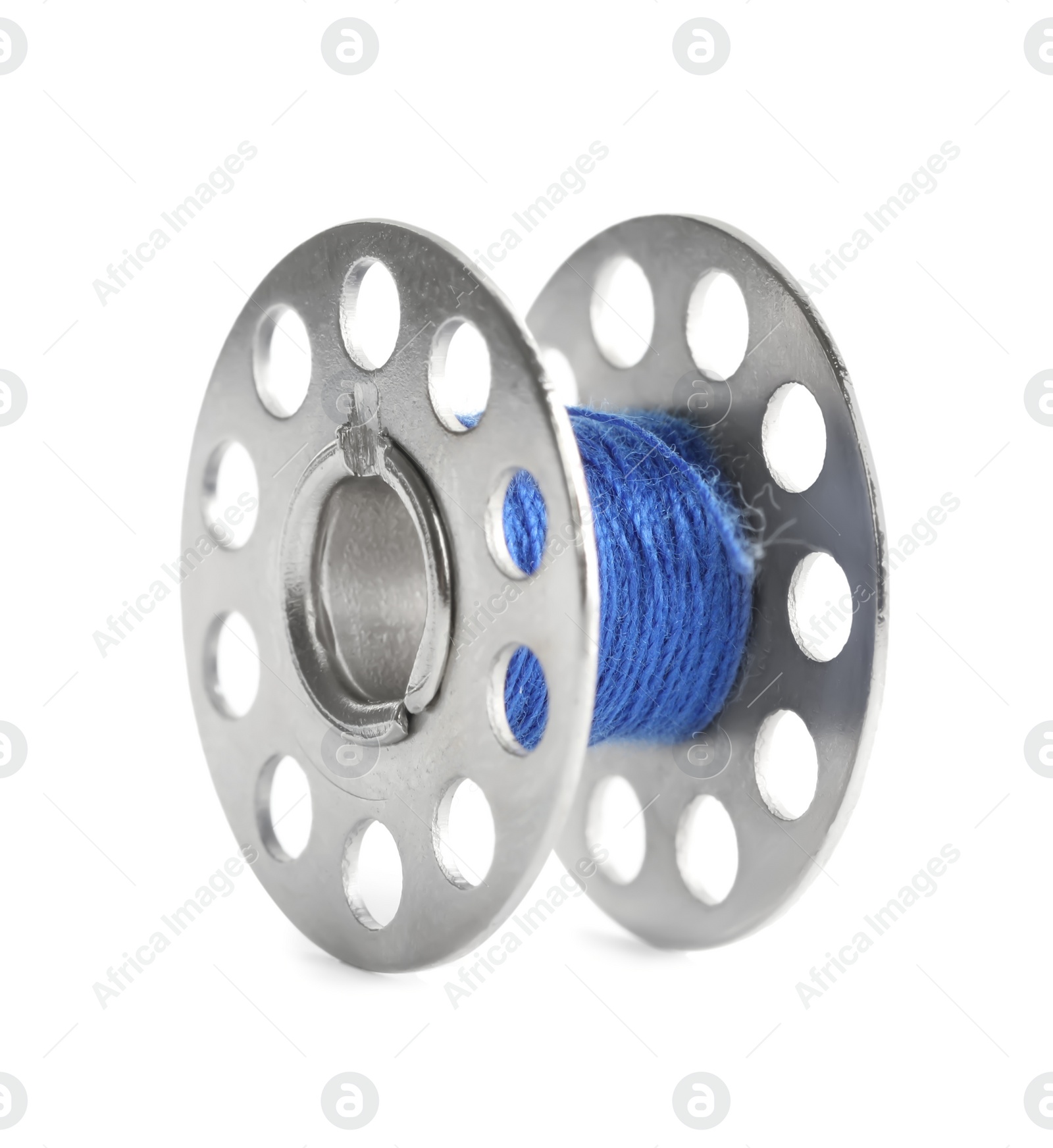 Photo of Metal spool of blue sewing thread isolated on white