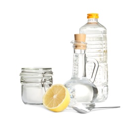 Composition with vinegar, lemon and baking soda on white background