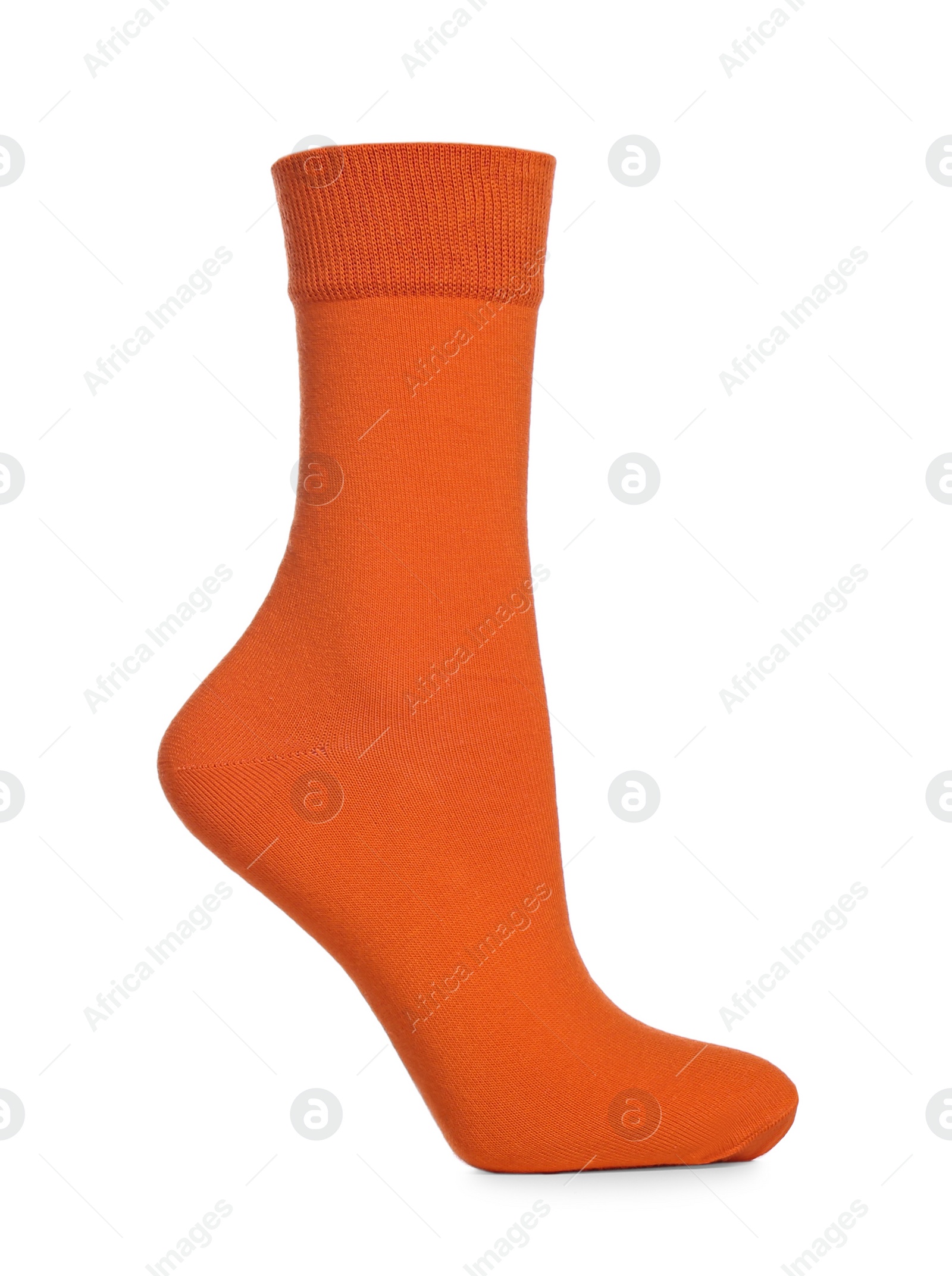 Photo of Orange sock isolated on white. Footwear accessory