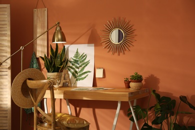 Beautiful room interior with wooden table near brown wall