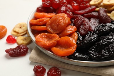 Photo of Delicious dried fruits on white table, closeup