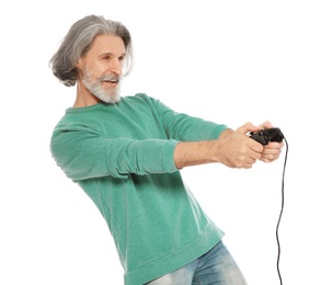 Emotional mature man playing video games with controller isolated on white