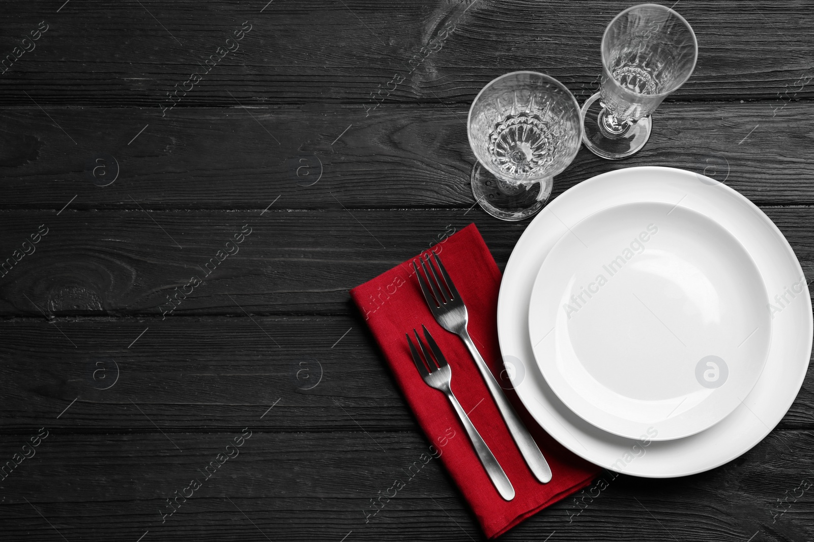 Photo of Elegant table setting on black wooden background, flat lay