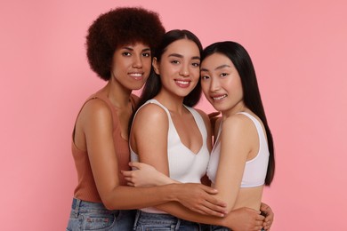 Photo of Portrait of beautiful young women on pink background