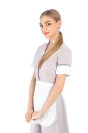 Portrait of young chambermaid in tidy uniform on white background