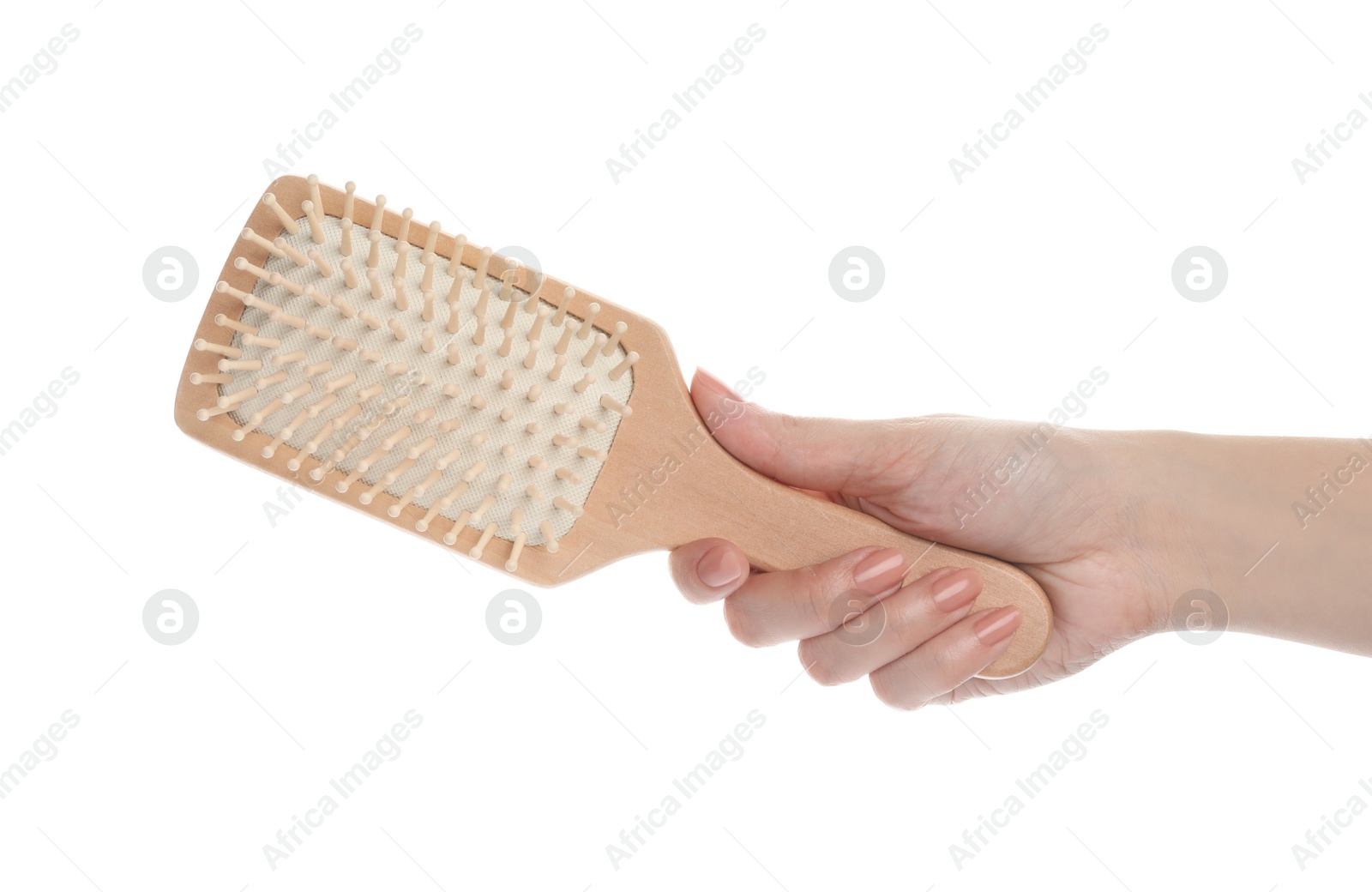 Photo of Woman holding wooden hair brush on white background, closeup