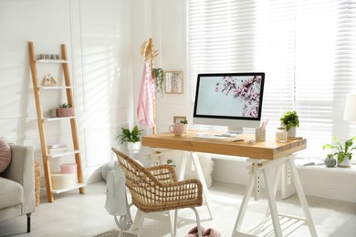 Stylish home office interior with comfortable workplace