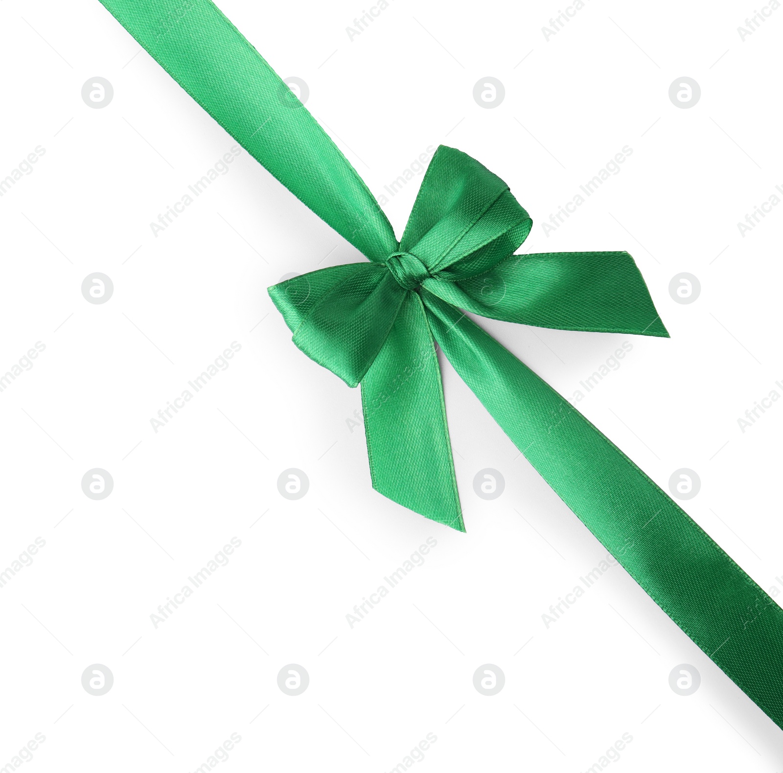 Photo of Green satin ribbon with bow isolated on white, top view