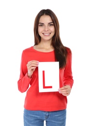 Photo of Young woman with L-plate on white background. Getting driving license