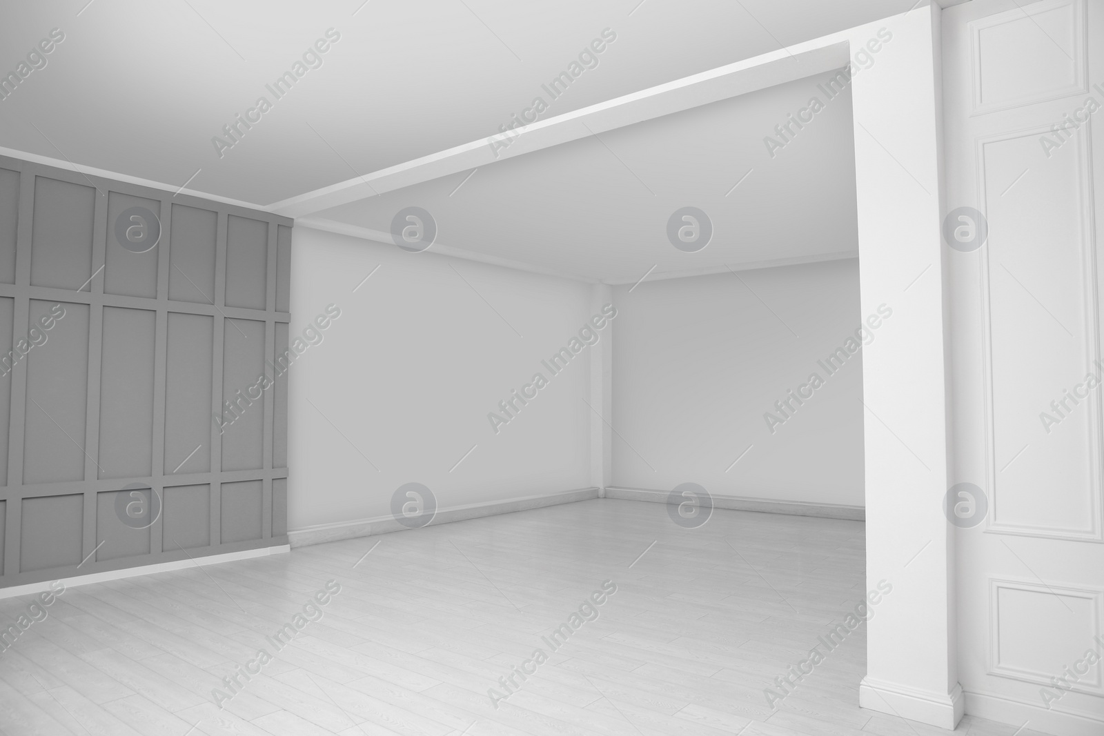 Photo of Empty room with grey wall and laminated floor