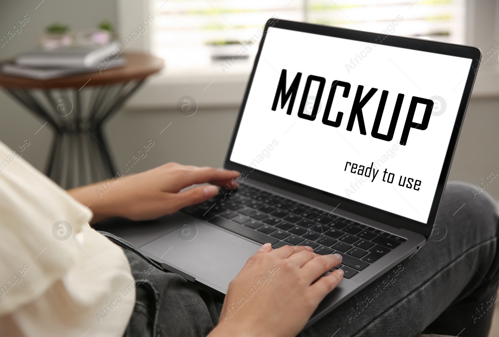 Image of Woman working via modern laptop with text Mockup Ready To Use on screen, closeup