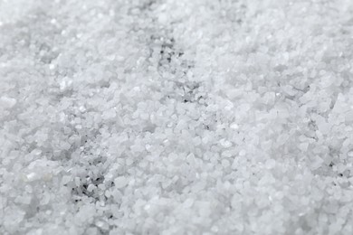 Photo of White natural salt as background, closeup view