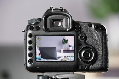 Photo of  blogger's workplace on camera screen, closeup
