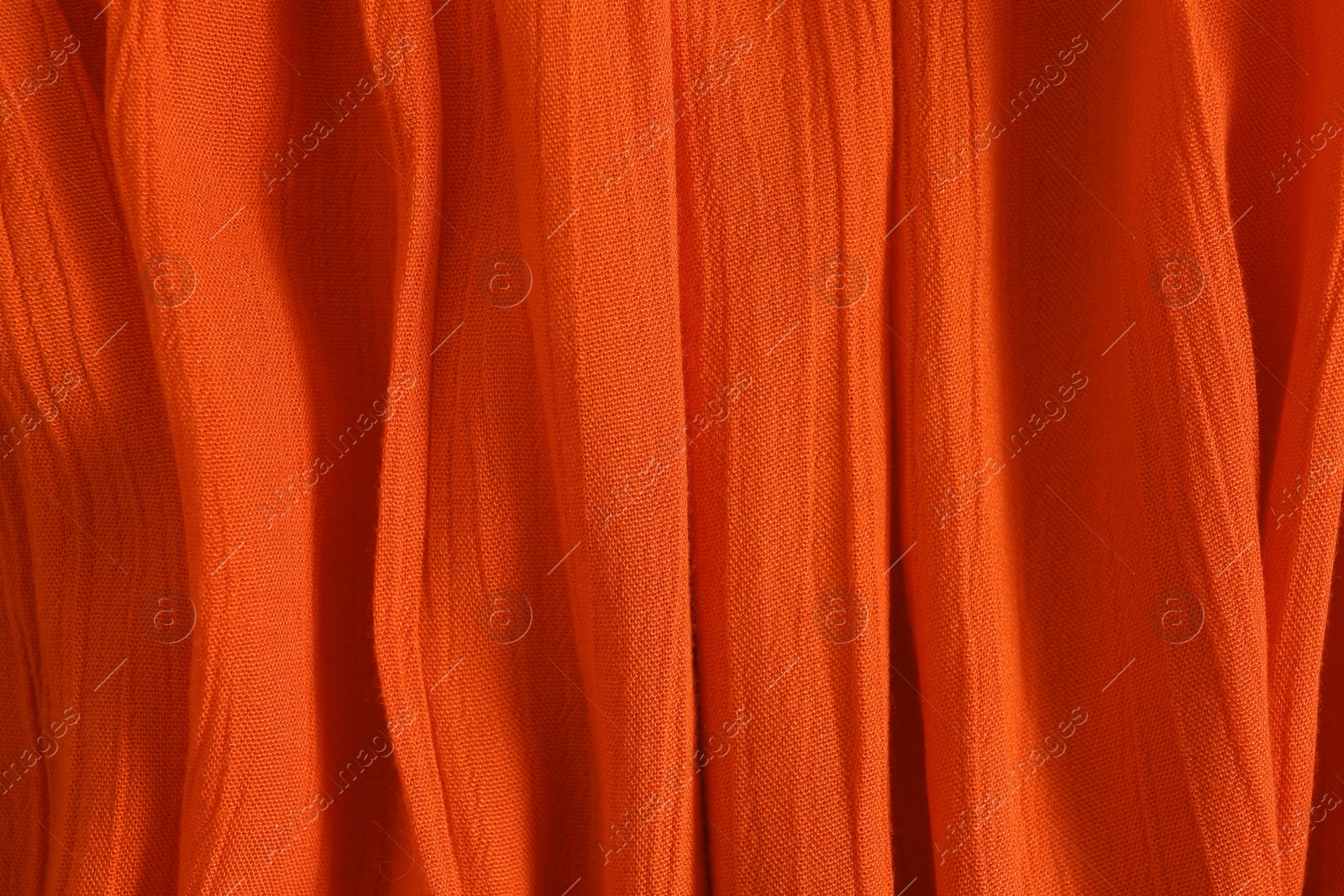 Photo of Texture of red fabric as background, closeup