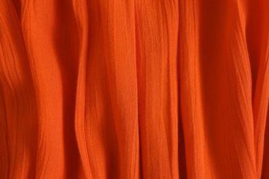 Texture of red fabric as background, closeup