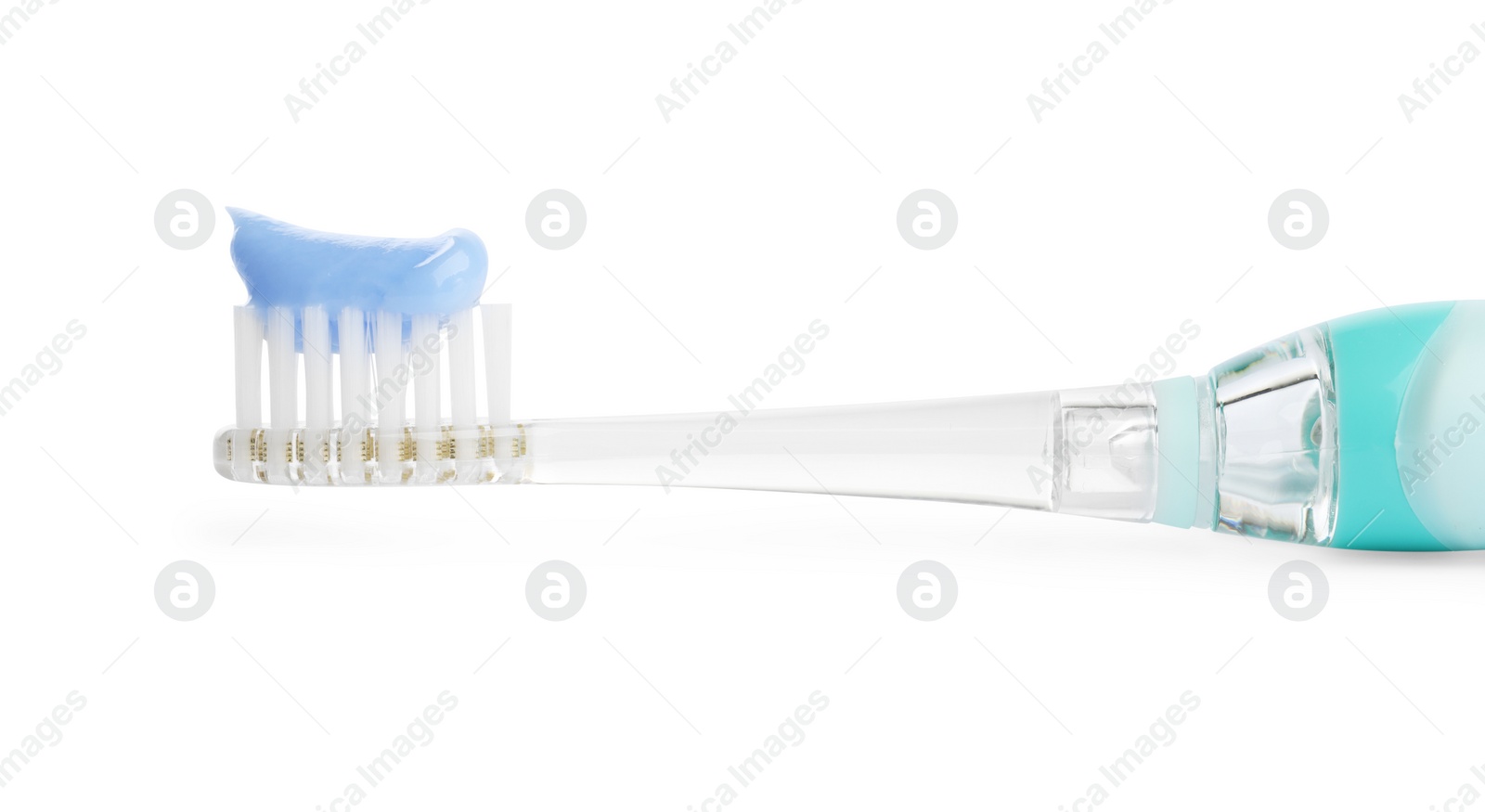 Photo of Electric toothbrush with paste on white background, closeup