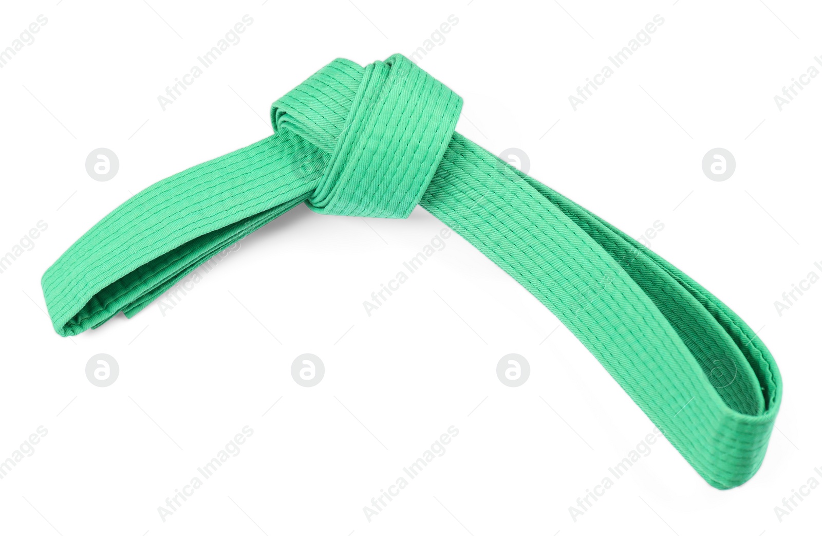 Photo of Green karate belt isolated on white. Martial arts uniform