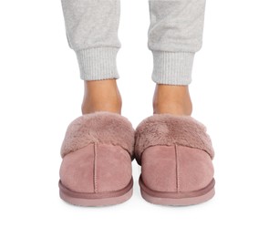 Woman in warm soft slippers on white background, closeup