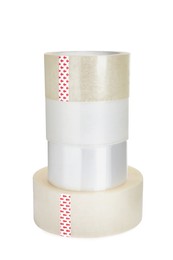 Photo of Many different rolls of adhesive tape on white background