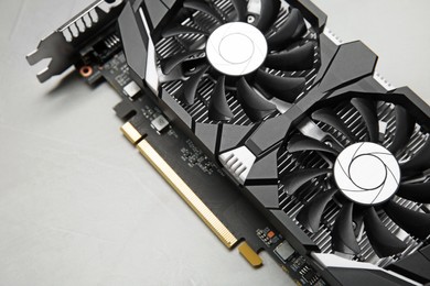 Photo of Computer graphics card on gray textured background, above view