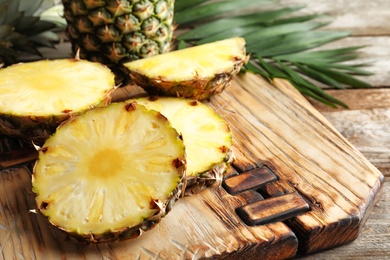 Pineapple slices on wooden board