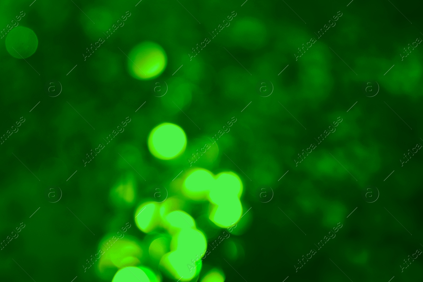 Image of St. Patrick day. Green background with blurred lights, bokeh effect