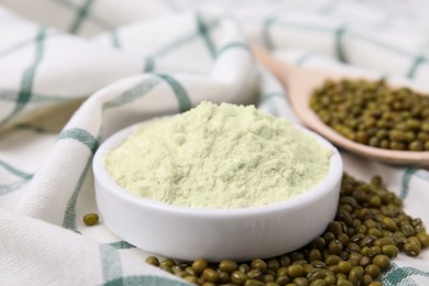 Photo of Bowl of flour and mung beans on cloth