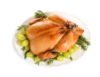 Photo of Platter of cooked turkey with garnish on white background, top view