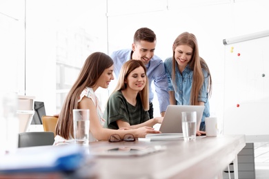 Photo of Young people having business training in office