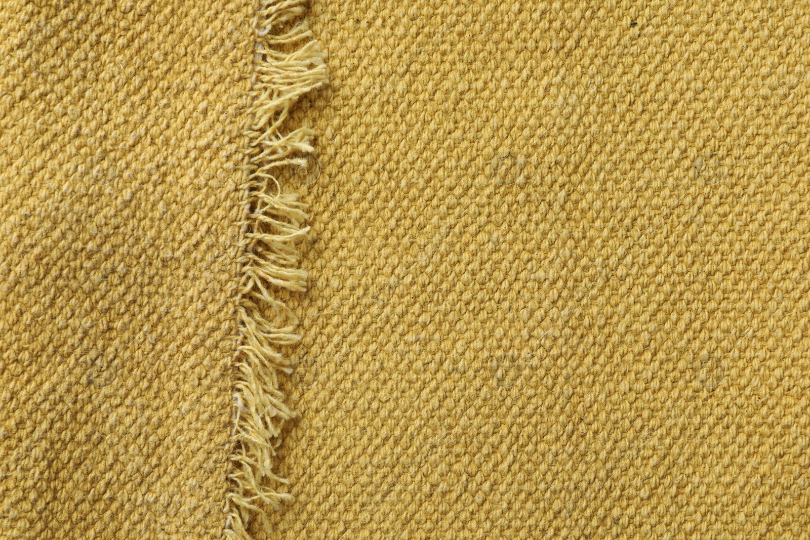 Photo of Texture of golden color fabric as background, top view