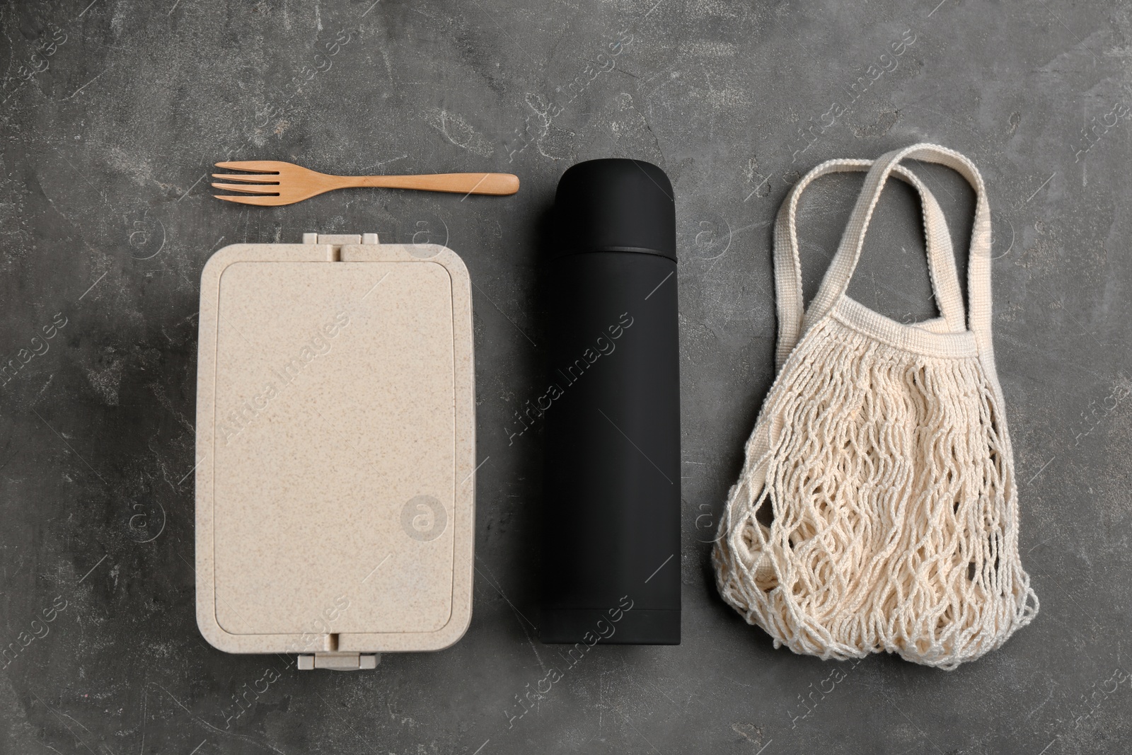 Photo of Flat lay composition with thermos on grey table