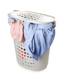 Photo of Plastic laundry basket full of clothes isolated on white