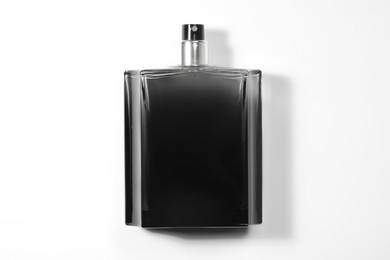 Luxury men`s perfume in bottle on white background, top view