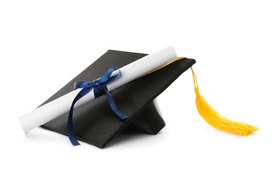 Graduation hat and diploma on white background