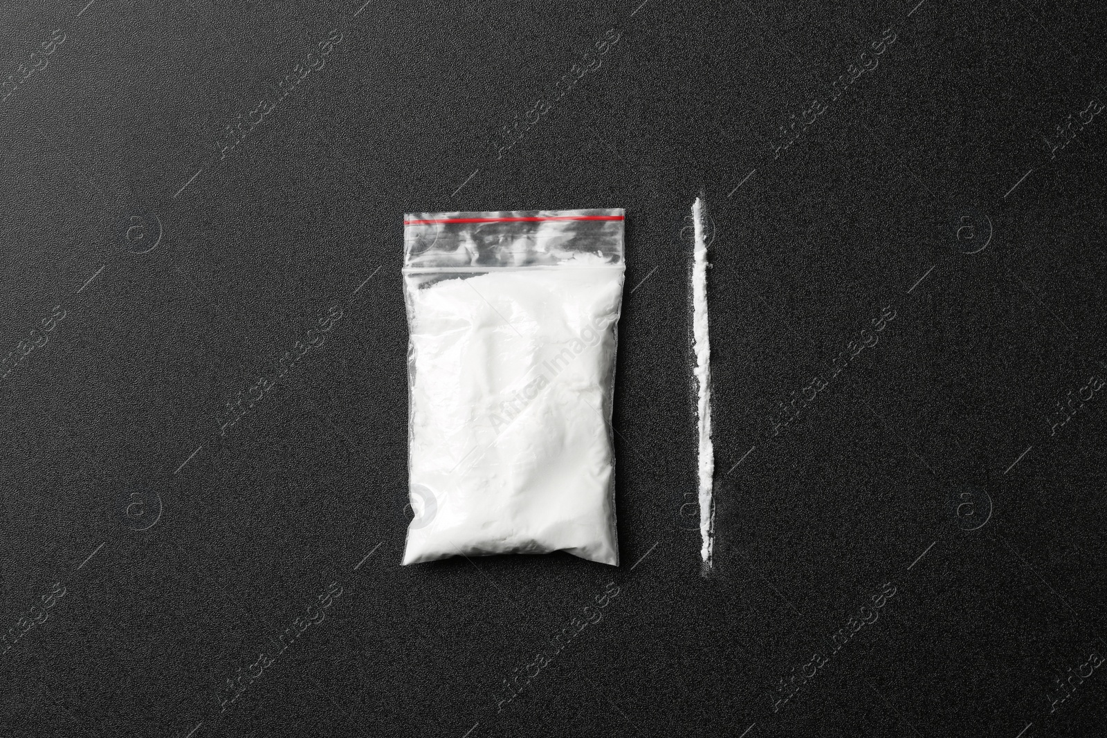 Photo of Flat lay composition with cocaine on dark background